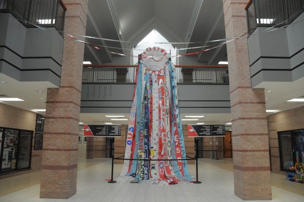 As students walk into school, the first thing they see is the 30-foot long mum.