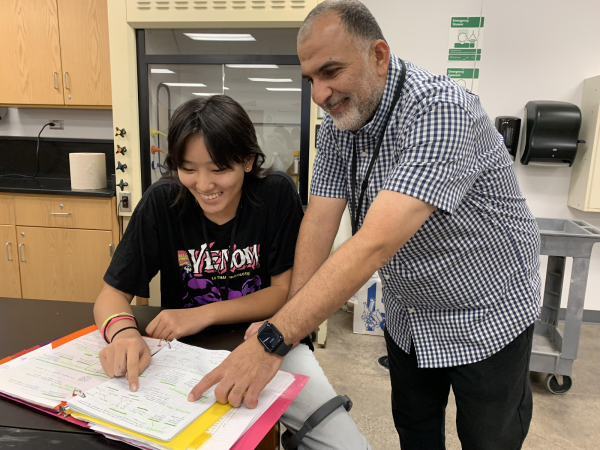 IB Higher Level Chemistry teacher Ahmed Belmir instructs senior Maelin Fan on Wednesday, September 18, 2024.