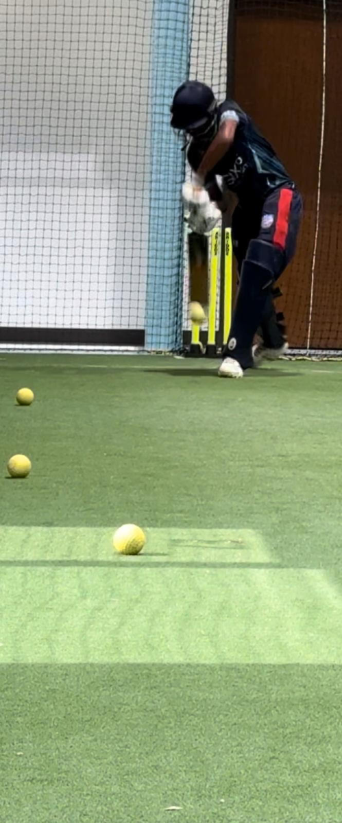 Cricketer Aaryan Salunke practices batting.